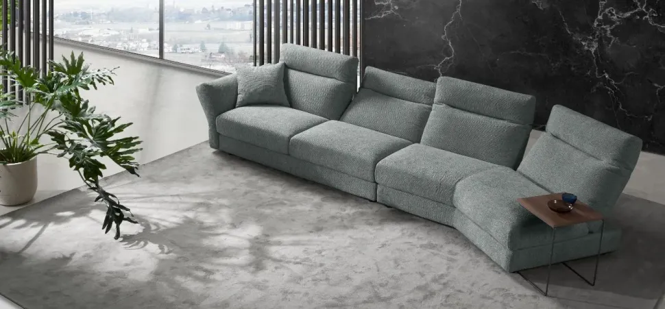 Divano Excò Divano mod.silky rovestito in tessuto con movimento relax in promo-sconto del 50% PREZZI OUTLET sconto 45%